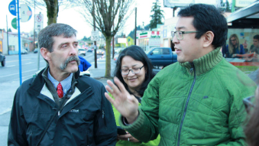 People discussing transportation options, walking down a city street