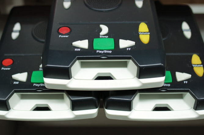 Stack of three players from the Talking Books library