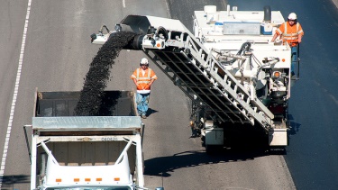 ODOT crew members remove old pavement from the roadway