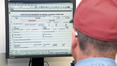 Man at computer using TransGIS tool