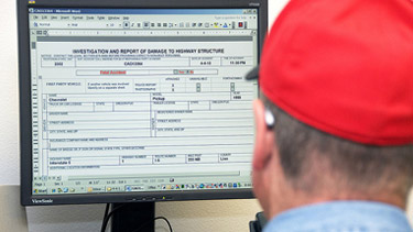 Person at computer filling out form
