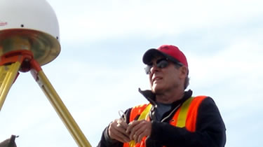 Employee working on GPS station corrector