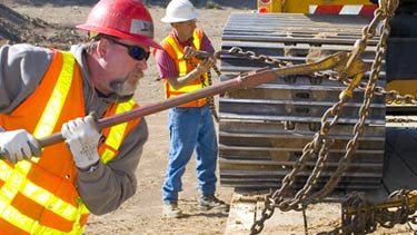 Instructor demonstrating how to tighten chains
