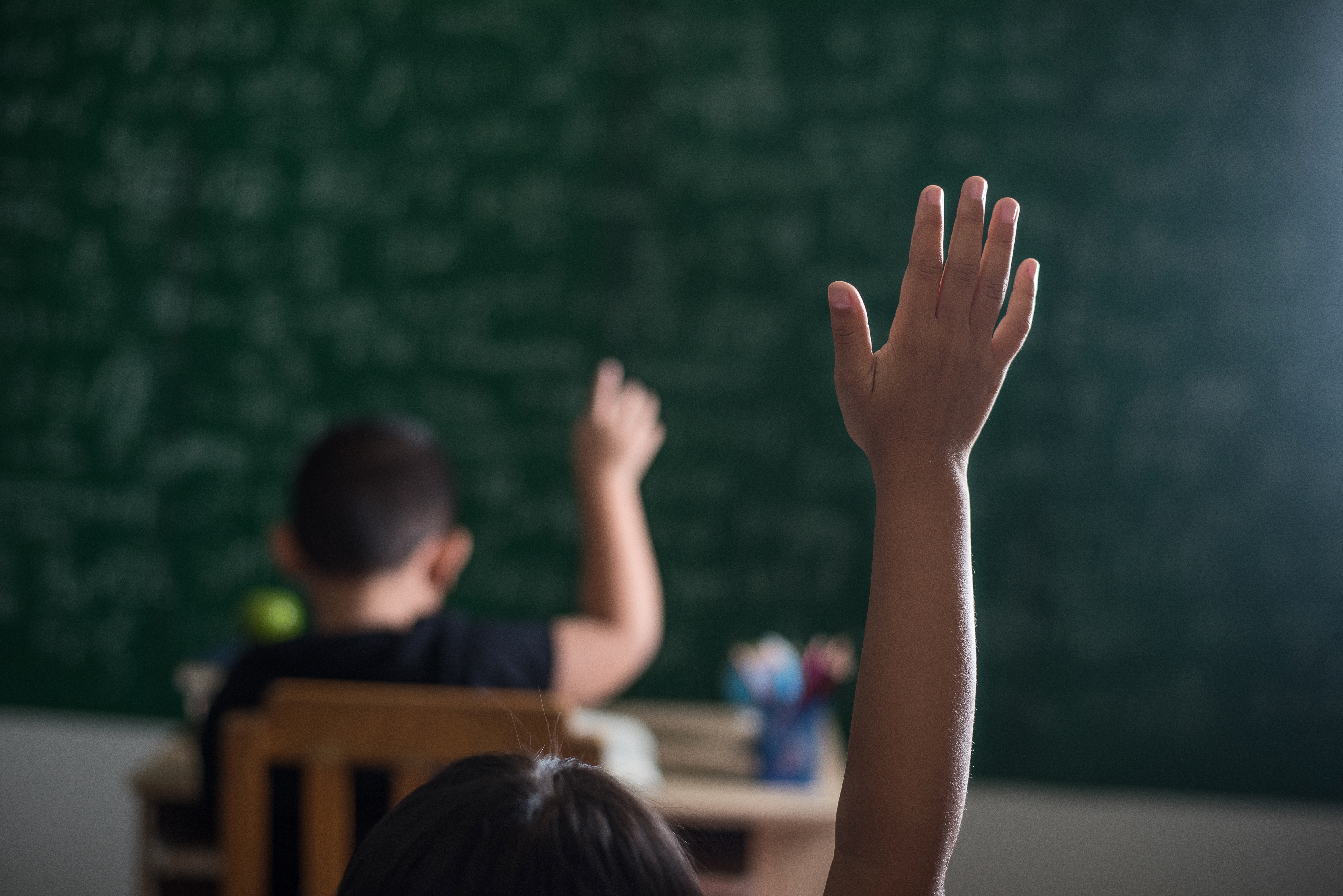 kid-raising-his-hand-classroom.jpg
