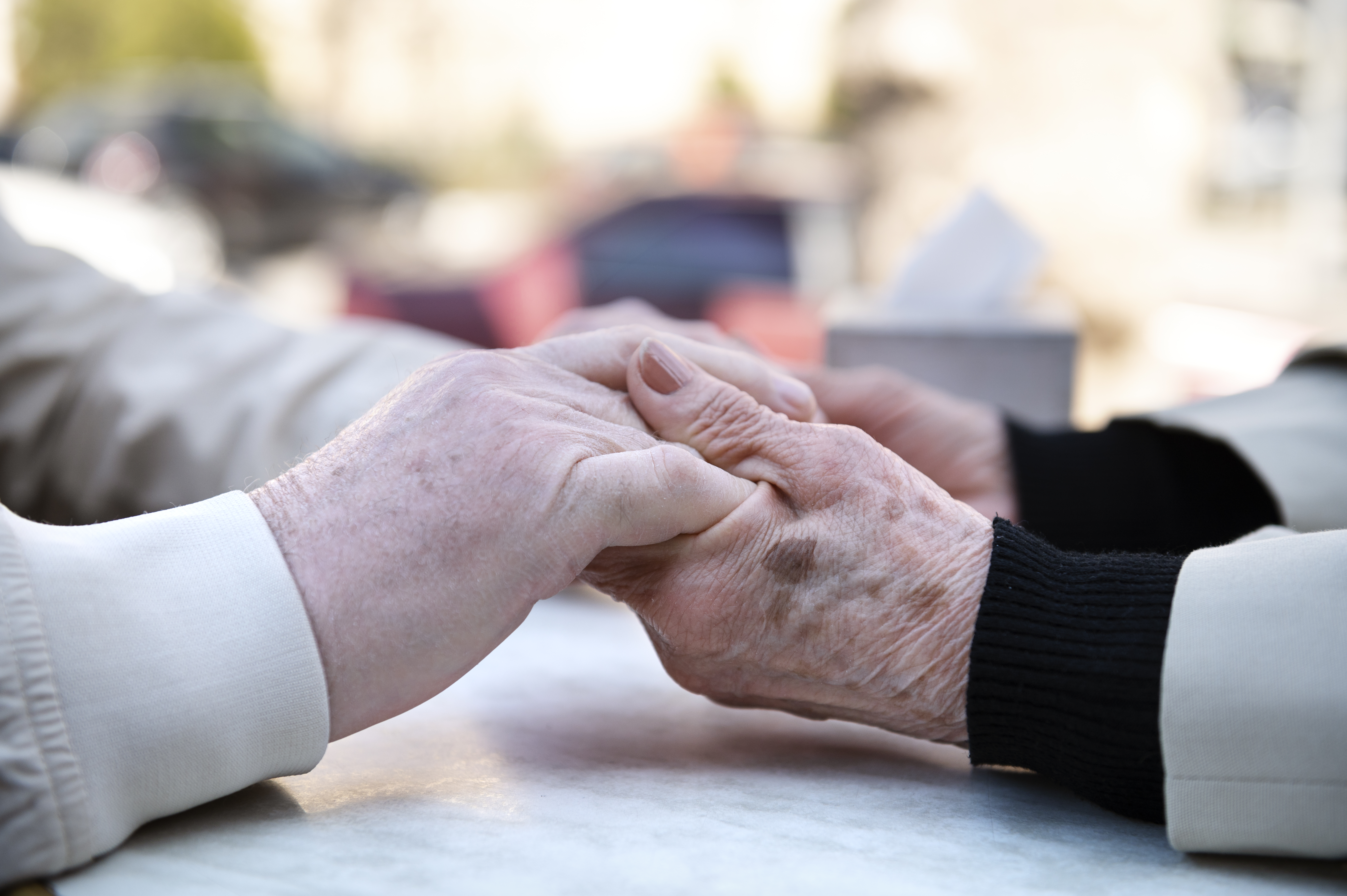 side-view-old-people-holding-hands.jpg