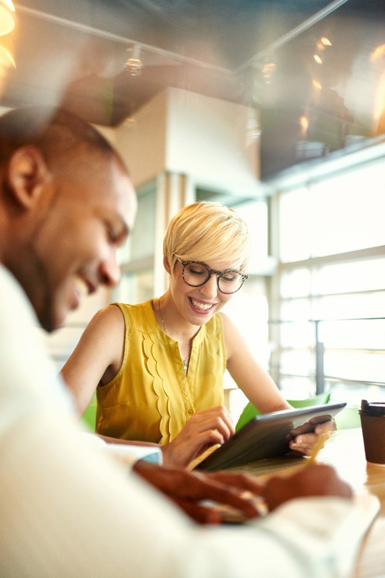 Two people work together in an office.
