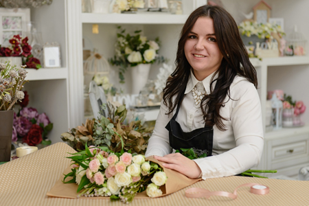 Blind woman works in a florist.