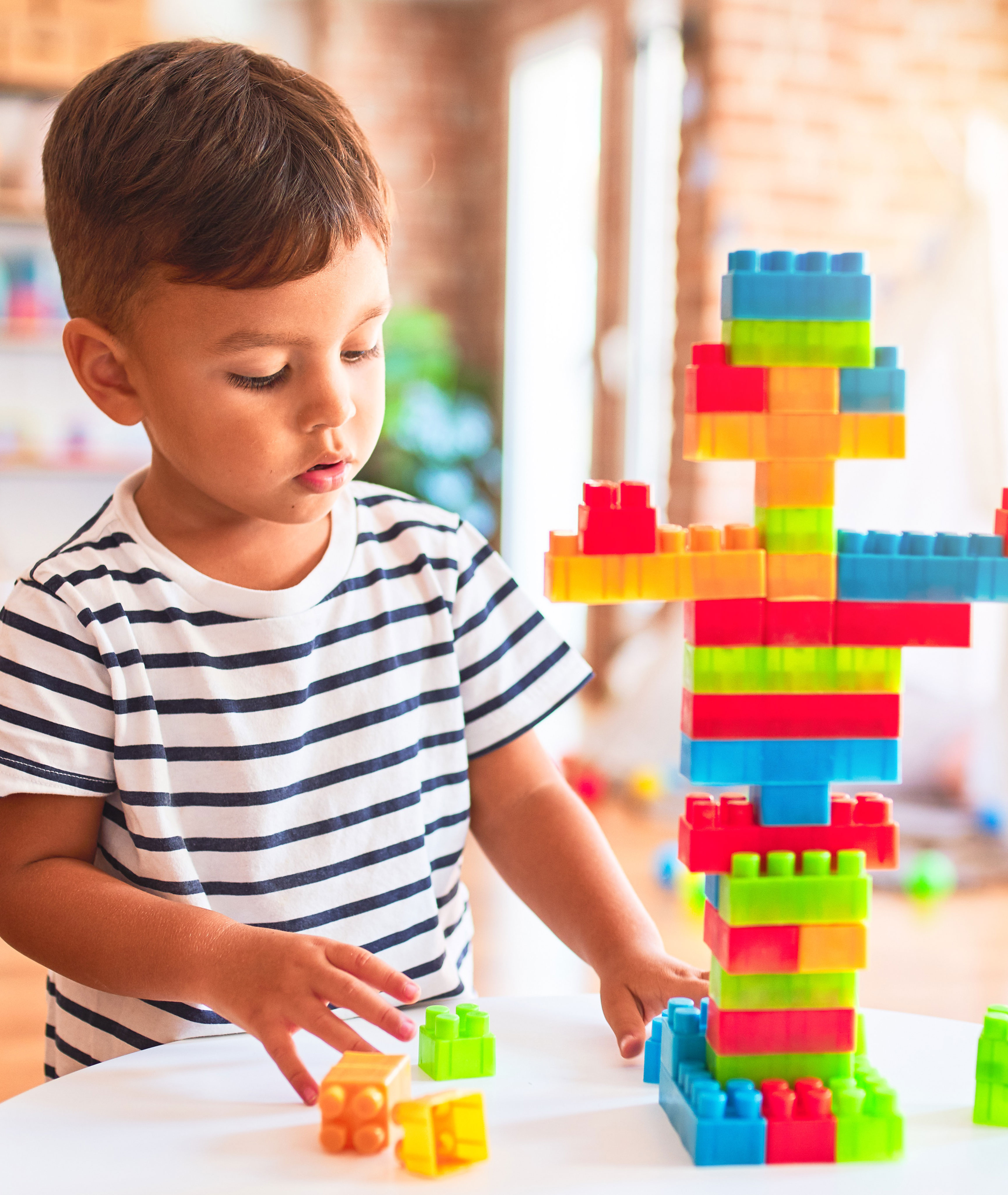 boy playing with legos