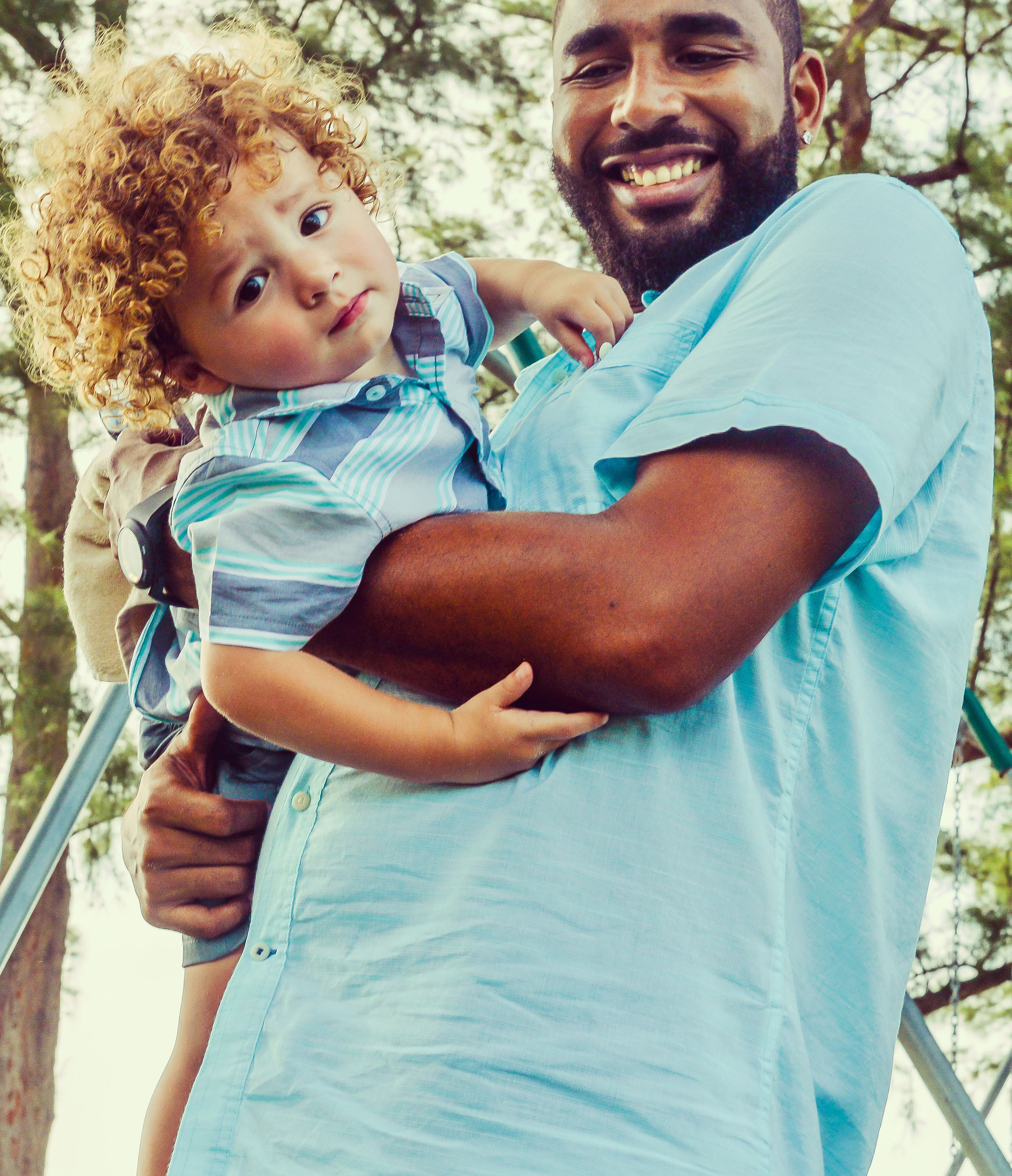 man holding toddler