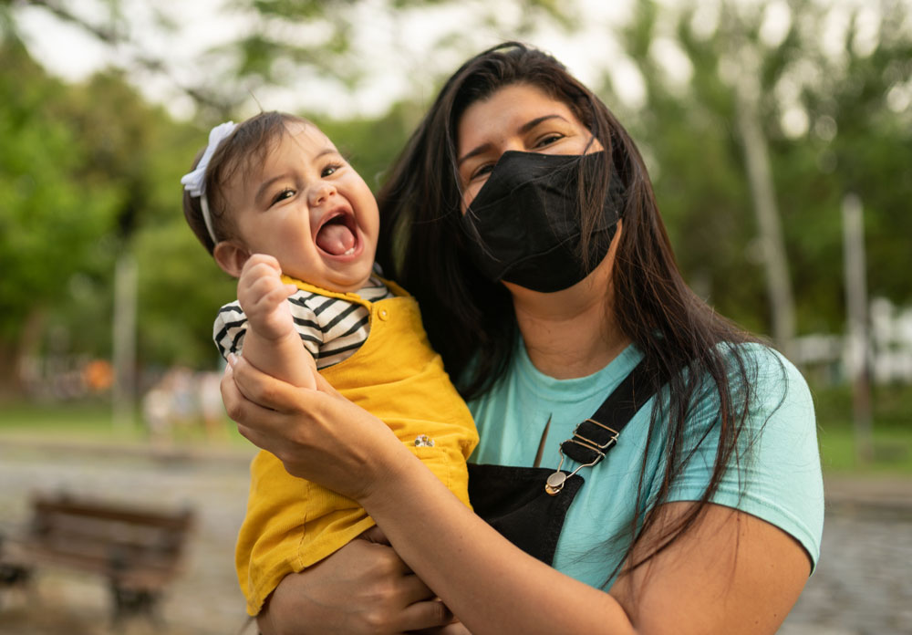 woman holding laughing child