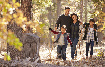 family on a hike in a forest