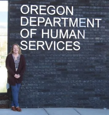 Maurita Johnson, standing in front of ODHS office