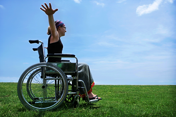 happy young woman in wheelchair