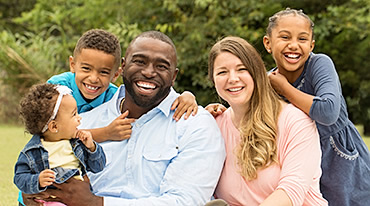 family outside smiling