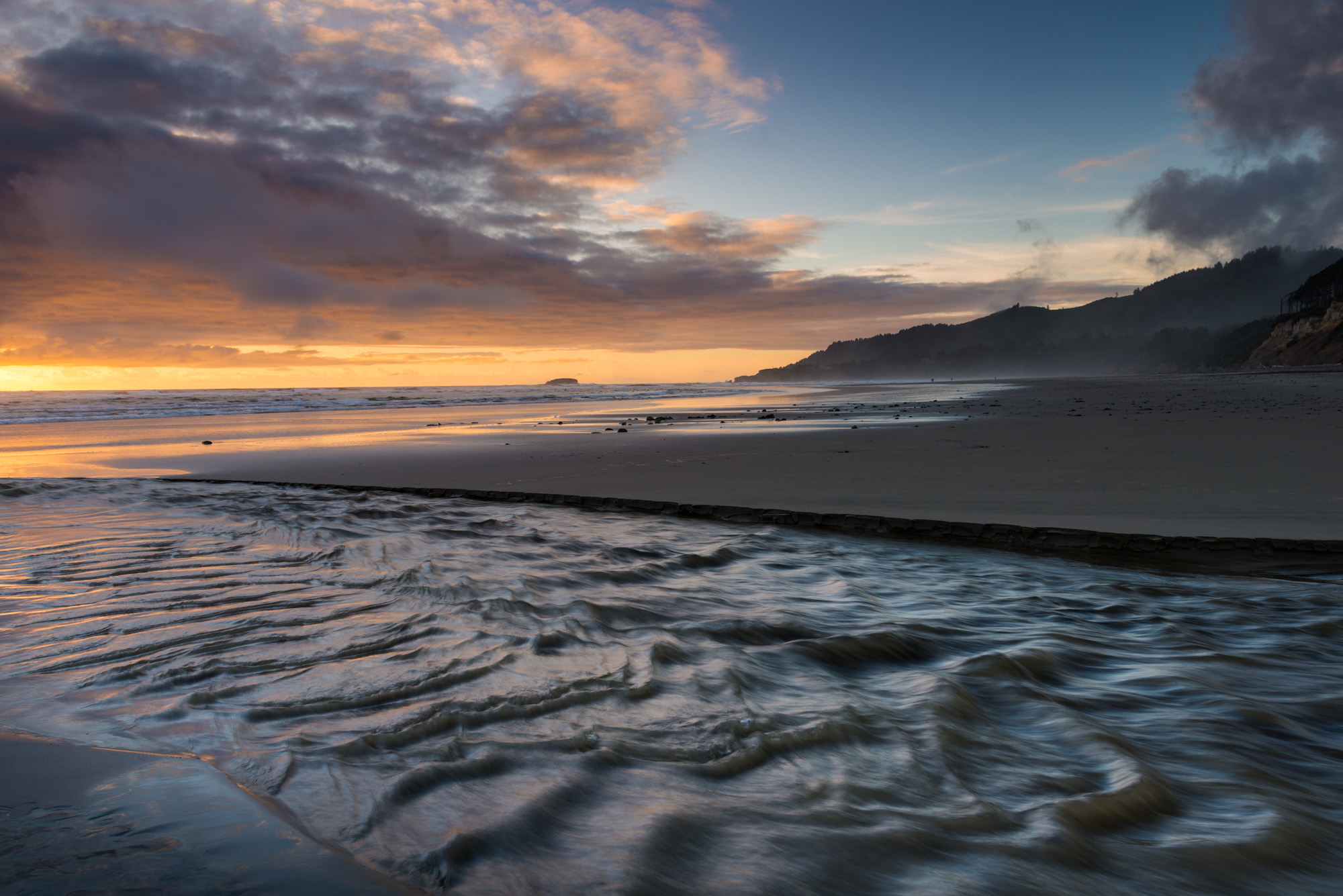 A photograph of Beverly Beach on the Oregon Coast seen at sunset
