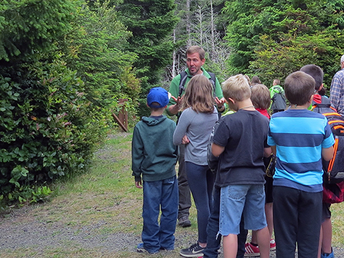 Children in group listening to teacher