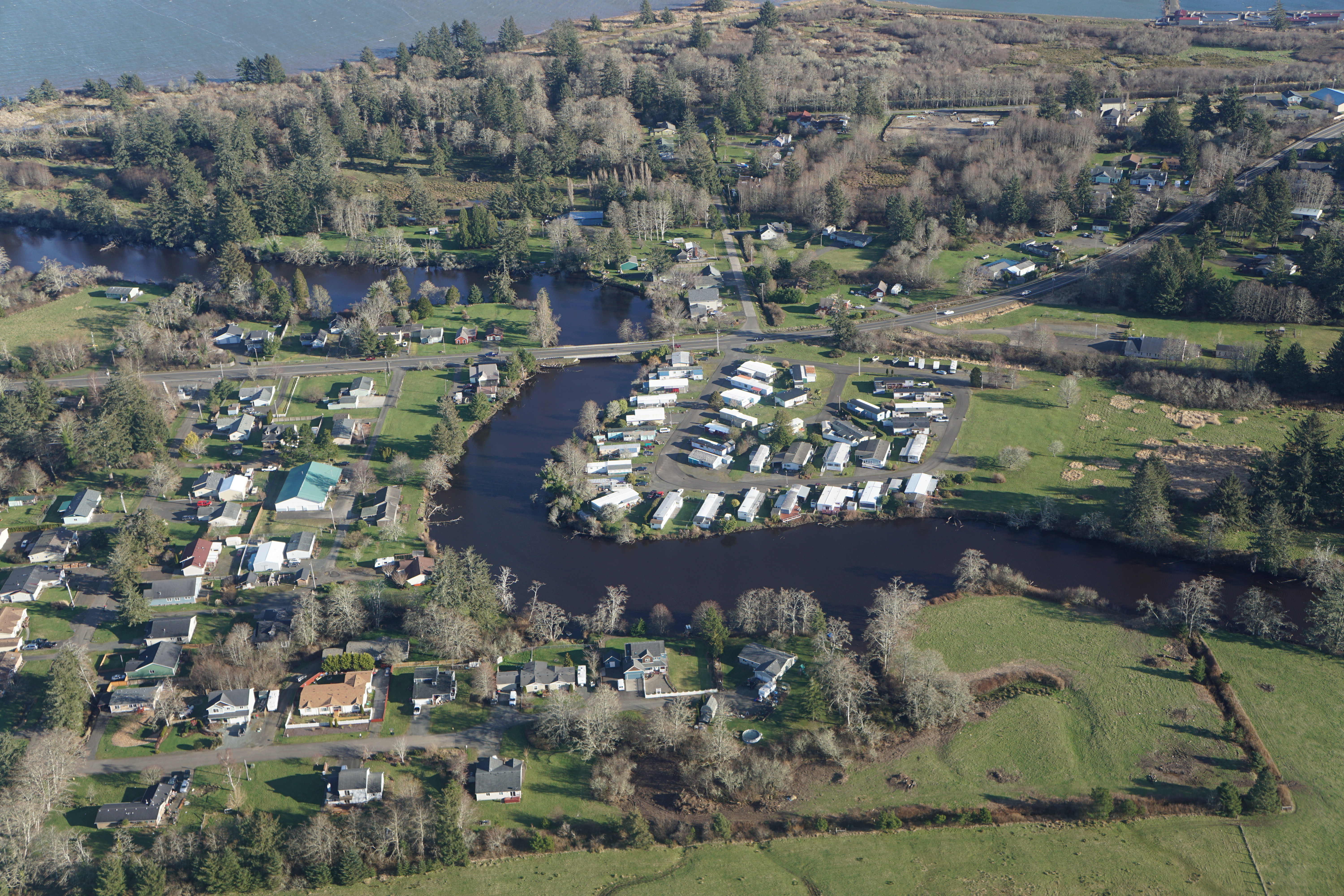 Aerial view of houses located along a river
