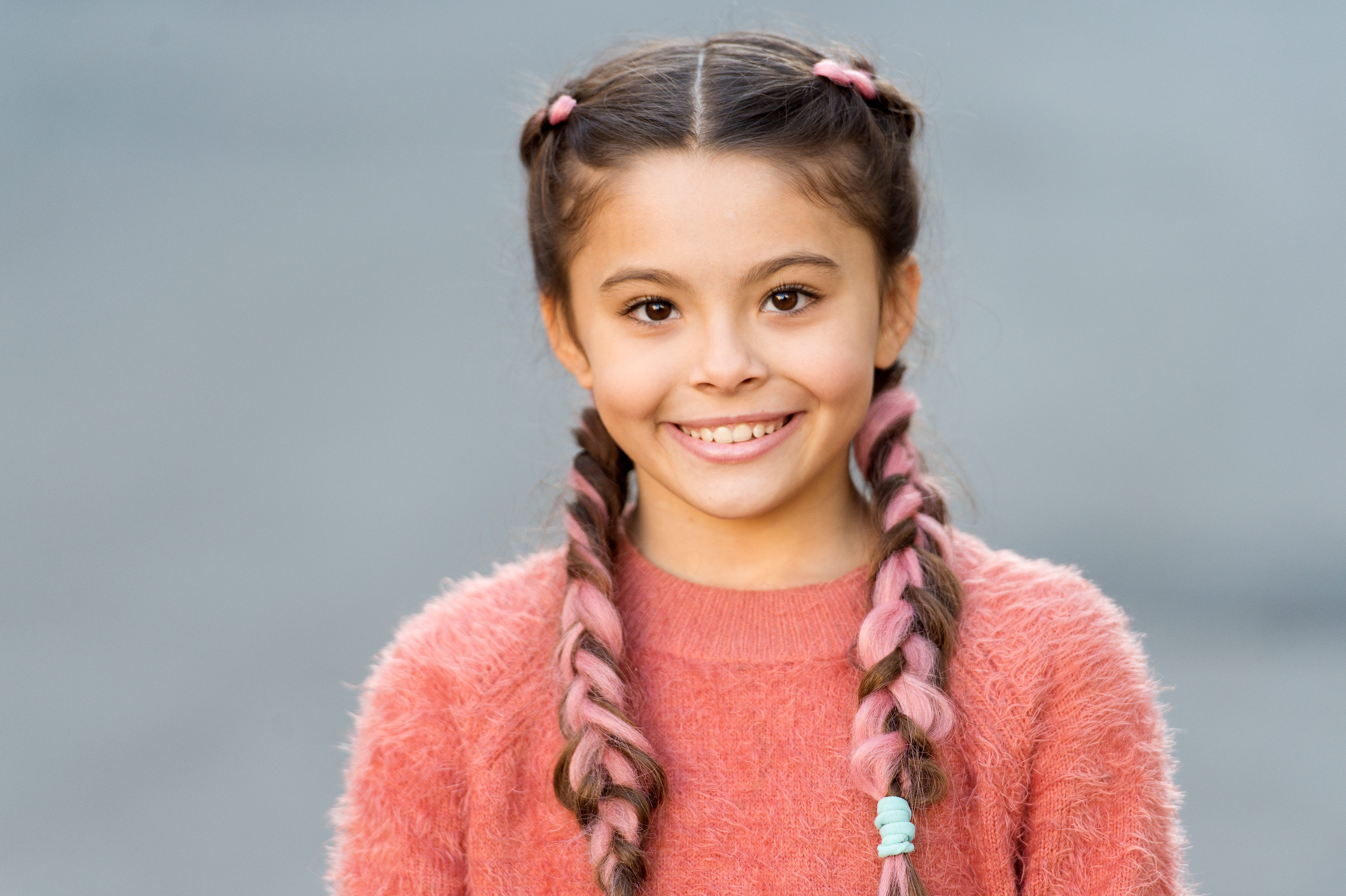 Young girl with braids and ribbons