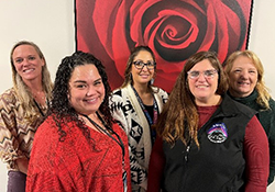 Group of five women standing together
