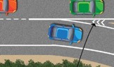 Una autopista. Los autos circulan por ella. Un auto toma una salida a la derecha. Entre el carril de salida y el carril derecho 