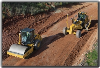 Construction equipment with GPS locators to guide vehicle paths