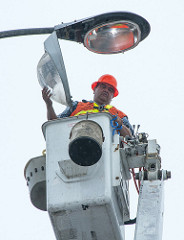 Maintenance work includes tending to overhead lighting