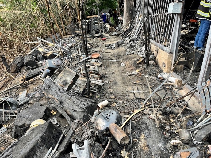 A burned camp before clean-up