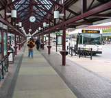 View outside of a bus station with parked bus