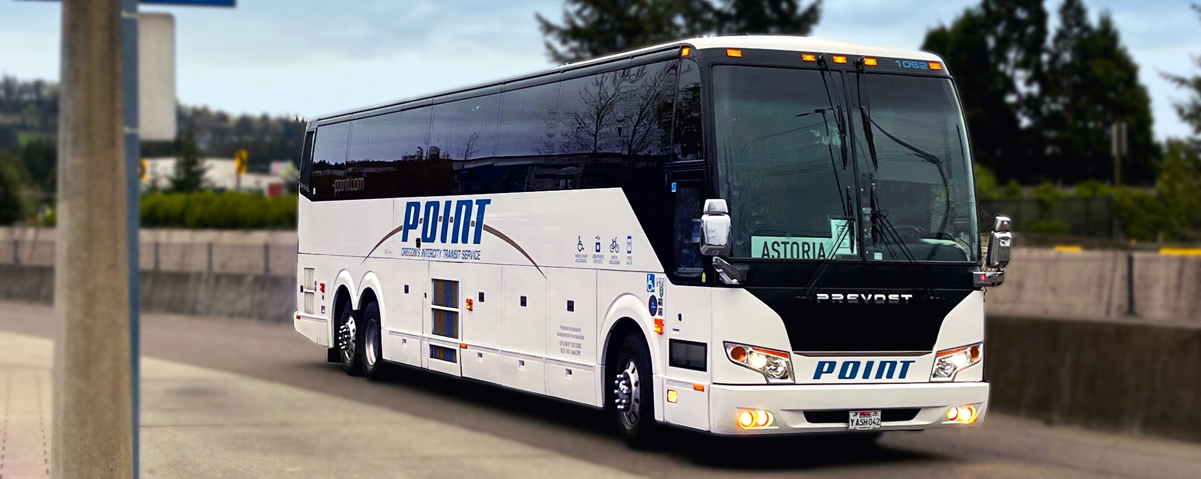 POINT Intercity Bus Parked with lights on