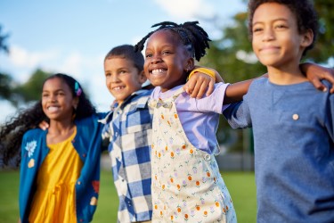 Four smiling schoolchildren