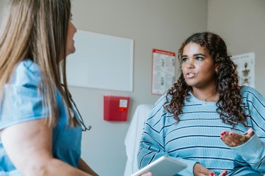 Teen and nurse at a health screening