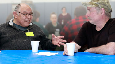 2 men talking