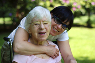 Elderly person being supported