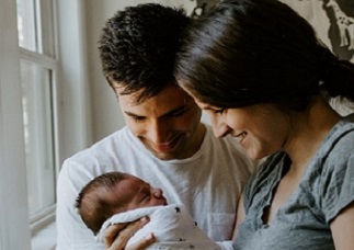 Family bonding time. Family bonding time. African American parents with daughter on bed. newborn stock pictures, royalty-free photos & images