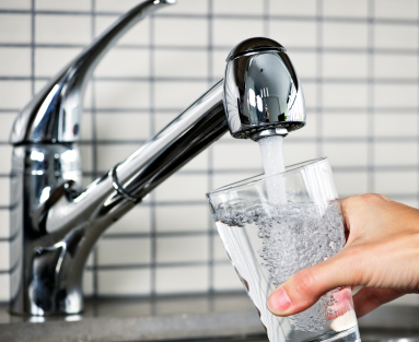 Filling a glass from a kitchen water faucet