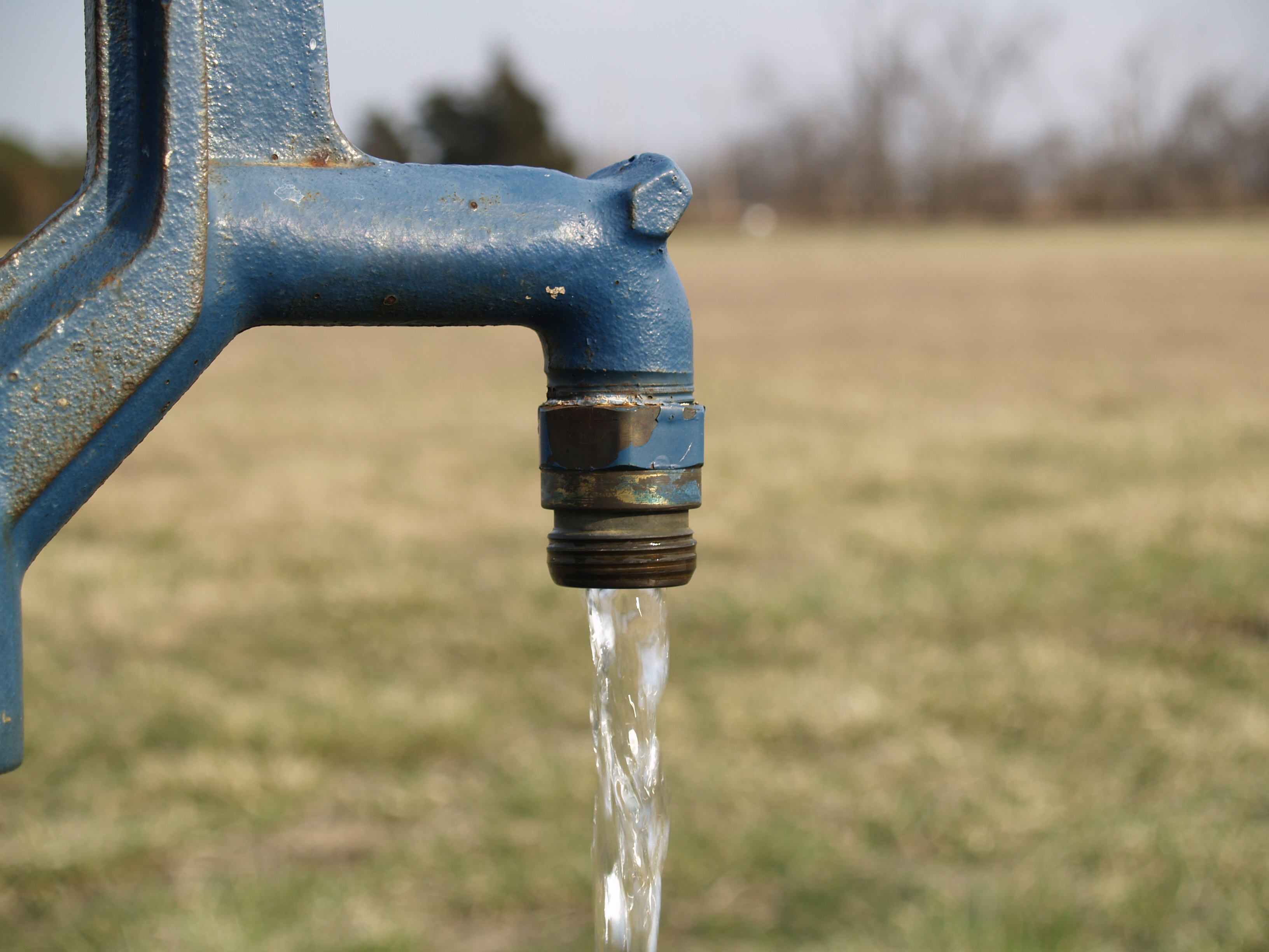 A spigot with water flowing