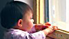 child at window