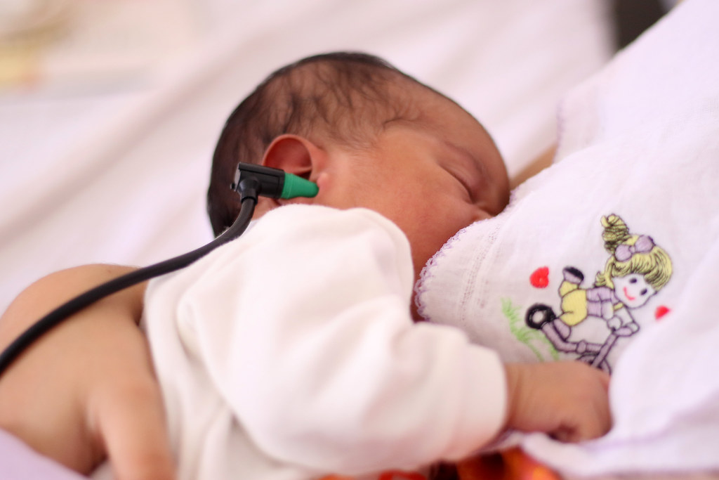 baby getting their hearing screened
