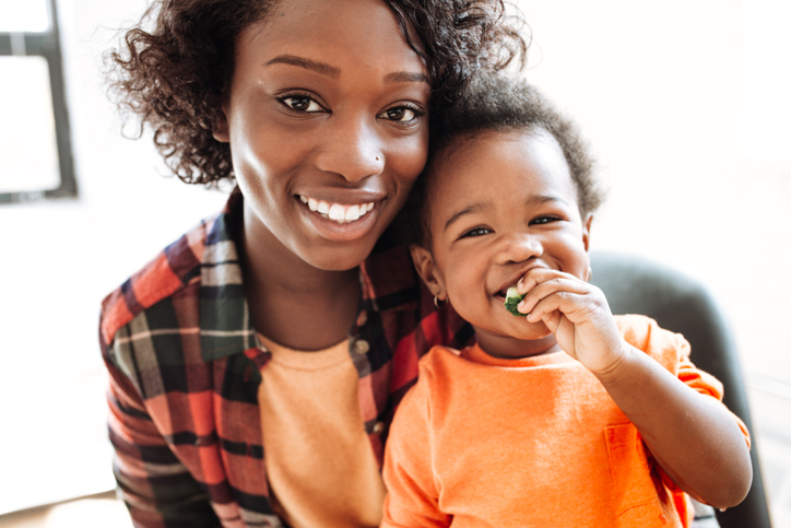 mom with toddler orange shirt iStock-621245224.jpg