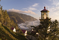 Oregon coast landscape with view of lighthouse, cliff and ocean waves