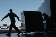 workers unloading SNS supplies