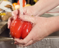 rinsing vegetables in sink