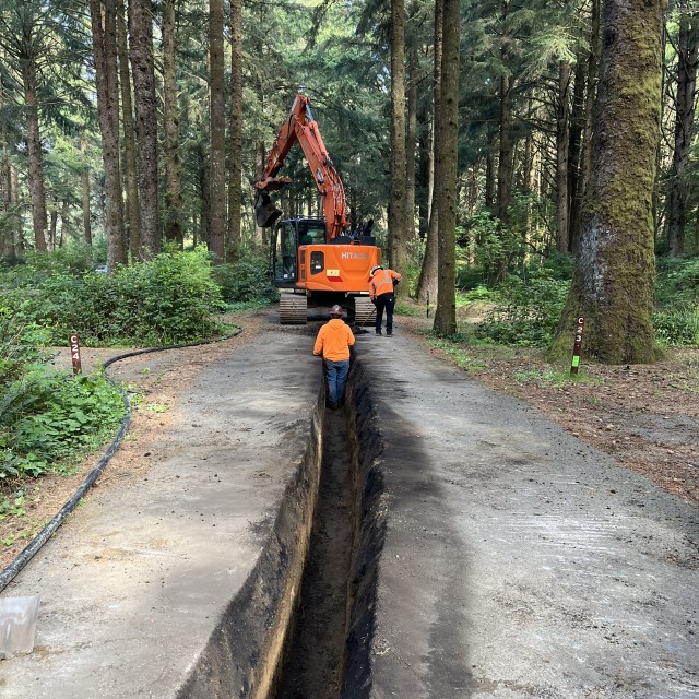 Crew working in trench at Beverly Beach