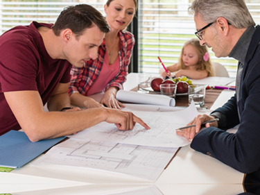 family speaking with engineer