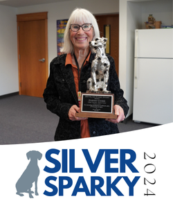 Garnet Cooke holding her award.