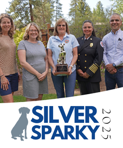 Sister-Camp Sherman Fire Corps holding their award.