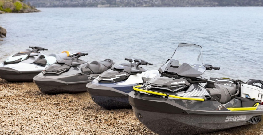 Image of several PWCs on the bank of a lake