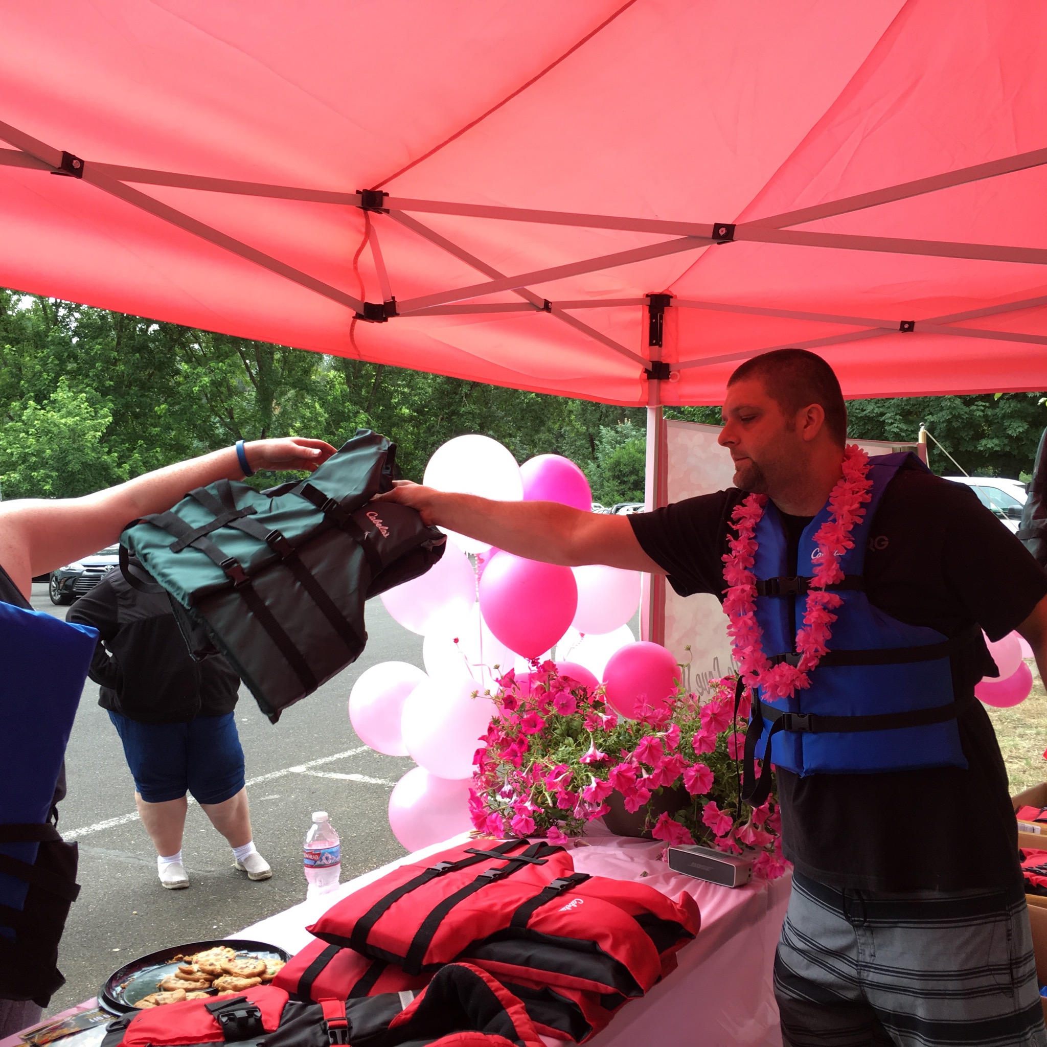 Meg's brother Derrek, handing out a free life jacket