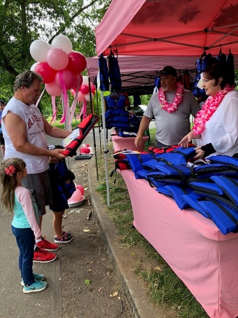 Rob and Jan O'Meara talking about life jackets to a son and daughter
