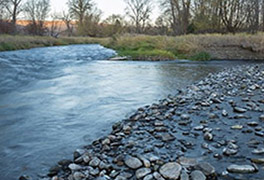 confluence of two creeks with gravel sidebar